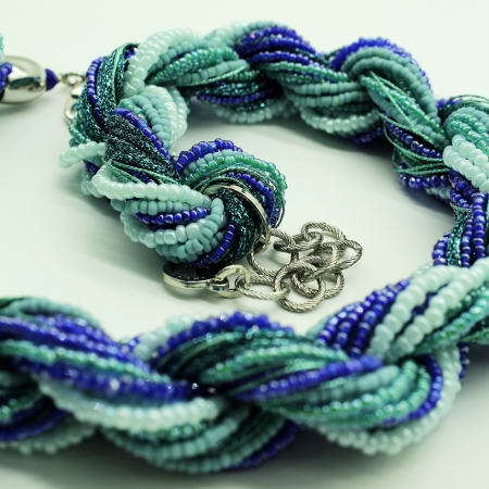Necklace Ottaviani woven with fabric and with blue and blue stones.