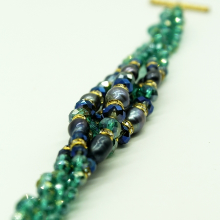 Multi-wire Ottaviani bracelet with green stones and blue pearls